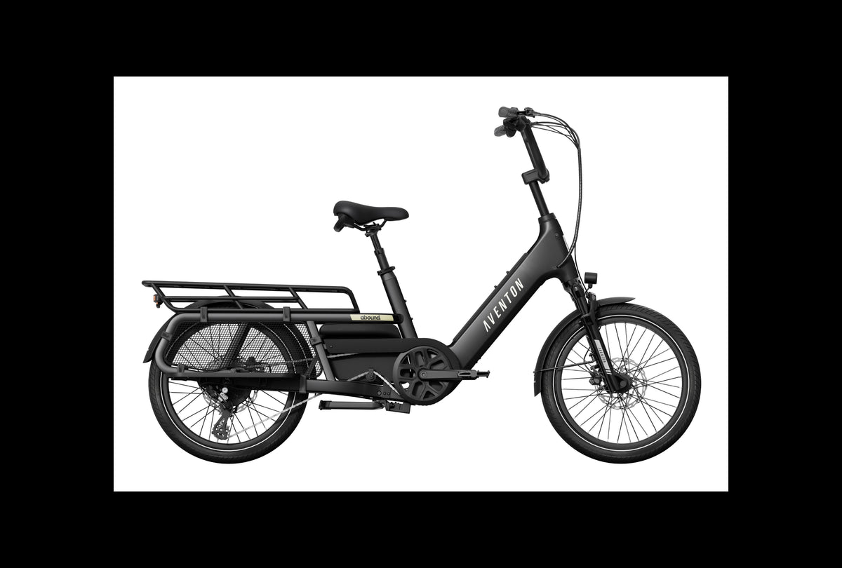 Black electric cargo bike with a basket on a white background